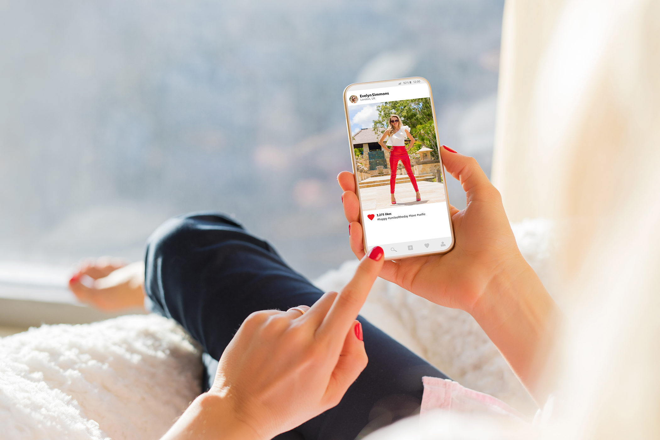 Woman looking at images on Instagram