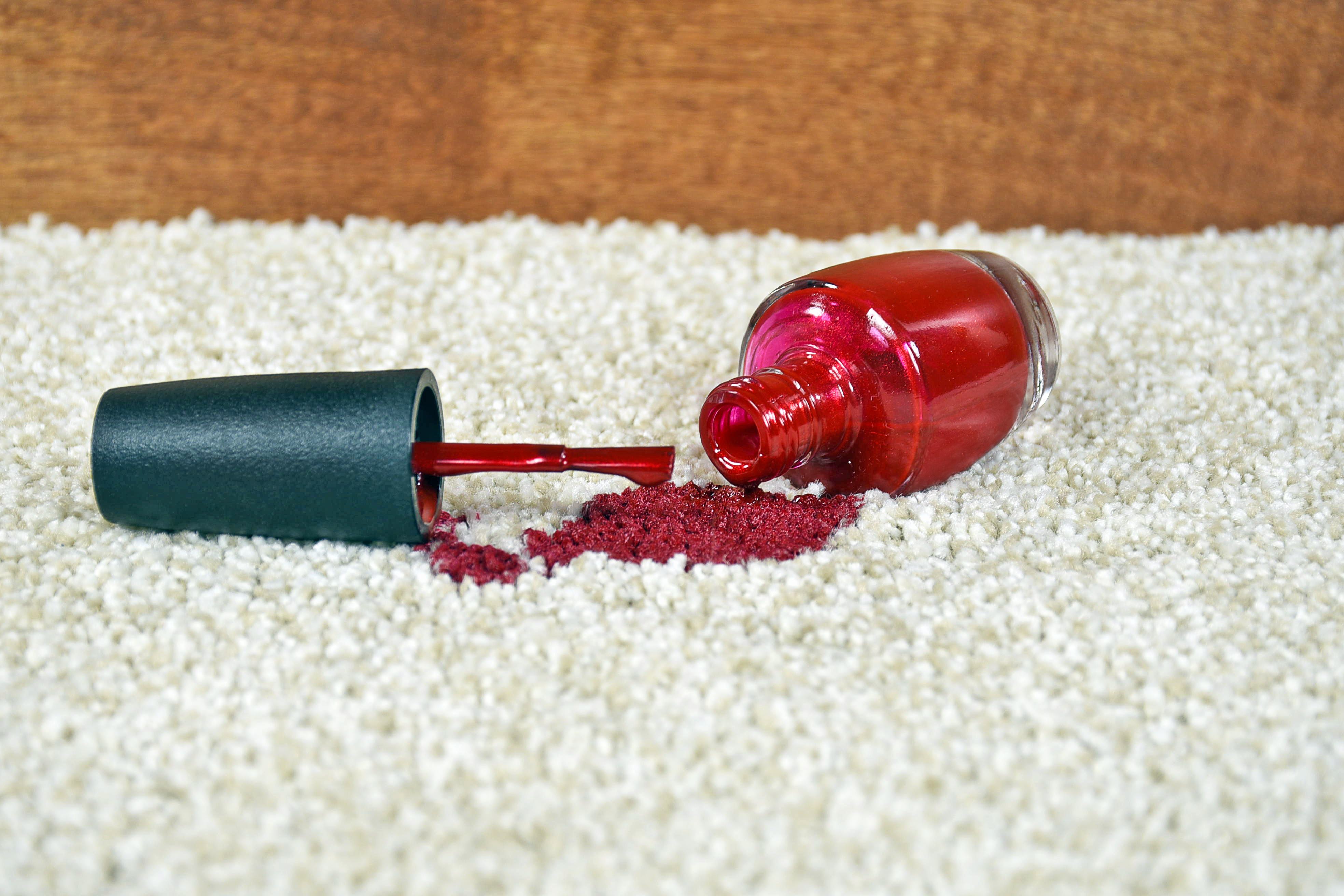 red nail polish spilt on carpet